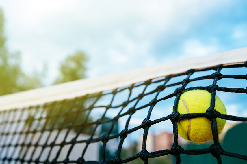 tennis-close-up-photo-of-tennis-ball-hitting-to-net-sport-concept-freepik-855px.jpg